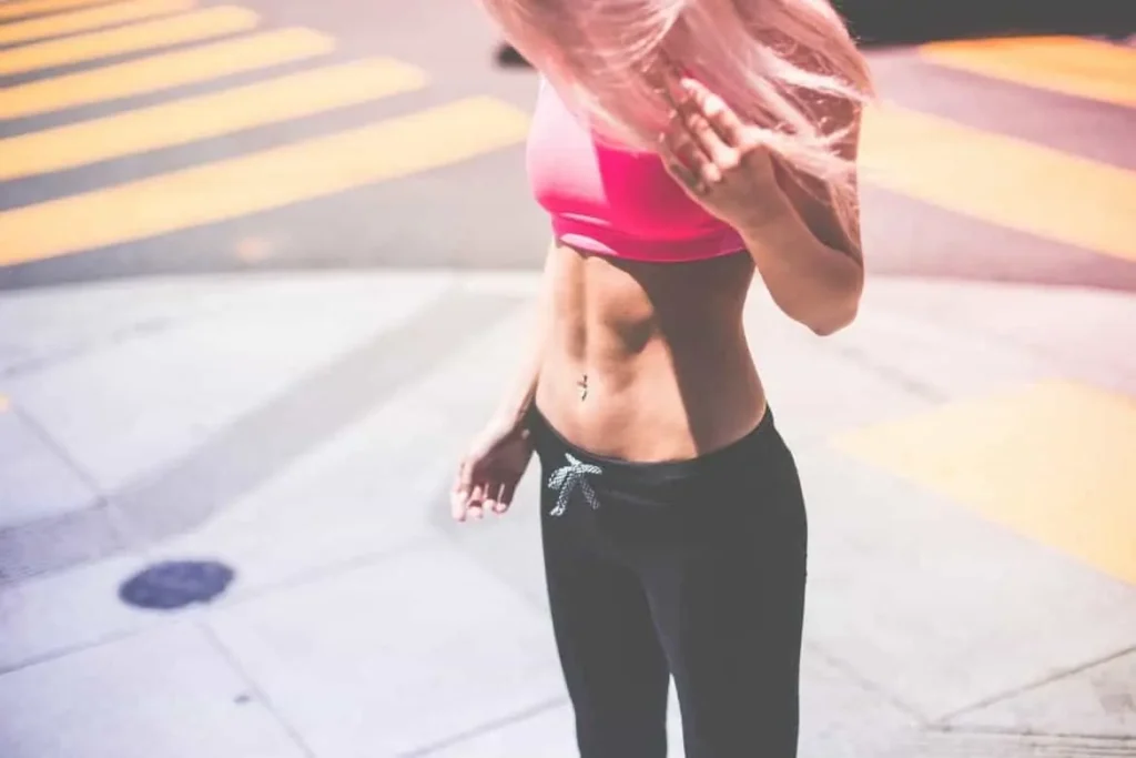 Woman with toned stomach after LA-EMS Body Sculpting Treatment Isleworth